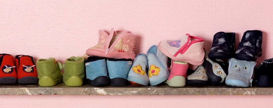 Baby's shoes on a shelve at the nursery
