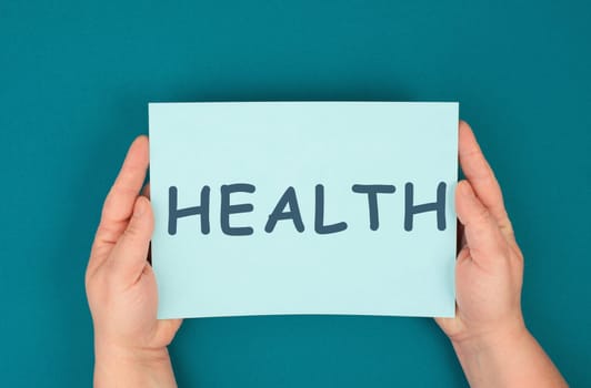 Health is standing on the paper, healthy lifestyle, medical care, prevention and insurance concept