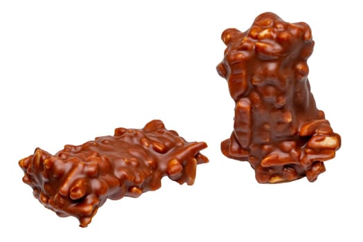 Chocolate candy with nuts isolated on a white background. Almond and nut slivers embedded in milk chocolate.