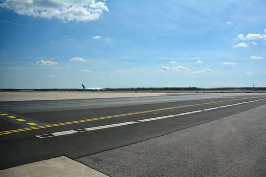 Frankfurt Airport Germany August 02, 2022 - Air Canada plane on the way to the runway with lots of tarmac and blue sky