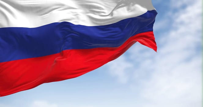 Russia national flag waving on a clear day. The Russian Federation is the largest country in the world. Fabric textured background. Selective focus. Realistic 3D illustration