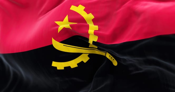 Close-up view of the Angola national flag waving in the wind. The Republic of Angola is a country of Southern Africa. Fabric textured background. Selective focus. Realistic 3d illustration