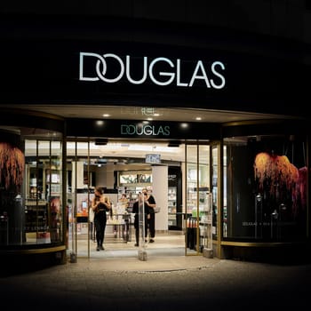 Douglas perfumery store in the popular shopping street Kurfuerstendamm in Berlin in the evening