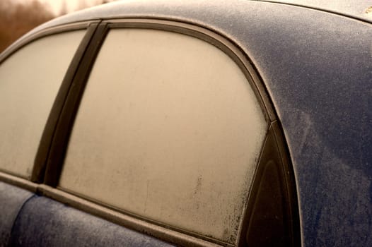 frozen windshield of a passenger car in winter. High quality photo