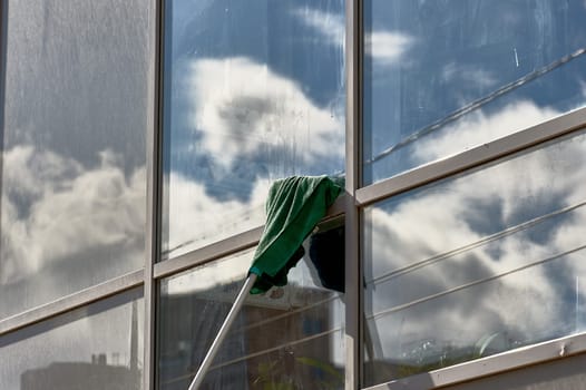 window washing, washing a street shop window. High quality photo