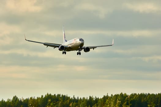 The Boeing plane is landing. Talagi Airport, Arkhangelsk, Russia, 27,08,2022. High quality photo