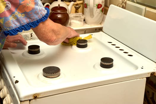 wet cleaning of the gas stove. High quality photo