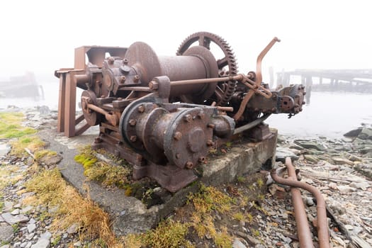 Old, rusty whale oil tanks and processing facilities at a now abandoned whaling station in Grytviken -on the island of South Georgia.