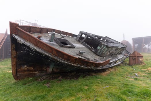 Old, rusty whaling ships and processing facilities at a now abandoned whaling station in Grytviken -on the island of South Georgia.