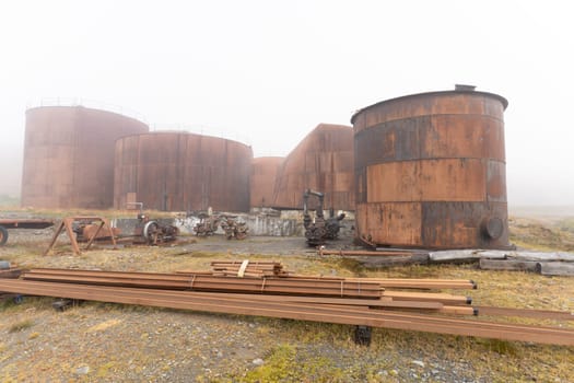Old, rusty whaling ships and processing facilities at a now abandoned whaling station in Grytviken -on the island of South Georgia.