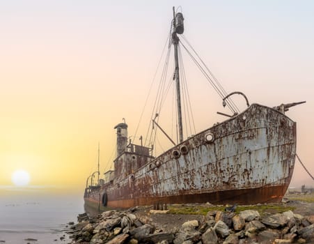 Old, rusty whaling ships and processing facilities at a now abandoned whaling station in Grytviken -on the island of South Georgia.
