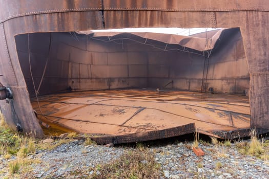 Old, rusty whale oil tanks and processing facilities at a now abandoned whaling station in Grytviken -on the island of South Georgia.