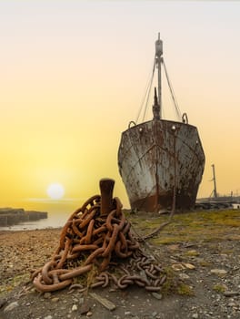 Old, rusty whaling ships and processing facilities at a now abandoned whaling station in Grytviken -on the island of South Georgia.