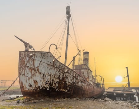 Old, rusty whaling ships and processing facilities at a now abandoned whaling station in Grytviken -on the island of South Georgia.