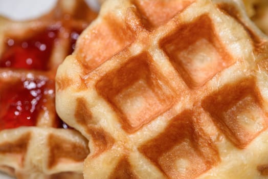 Top view close up of fresh waffles delicious sweet. Making homemade food or dessert at home