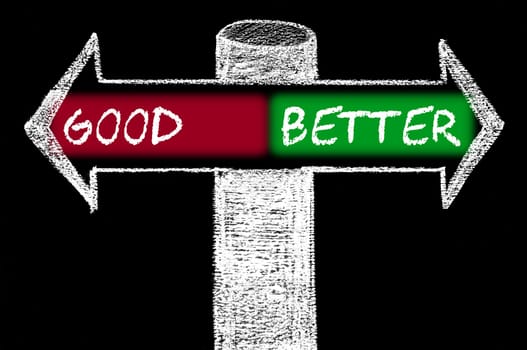 Opposite arrows with Good versus Better. Hand drawing with chalk on blackboard. Choice conceptual image