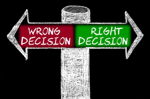 Opposite arrows with Wrong Decision versus Right Decision. Hand drawing with chalk on blackboard. Choice conceptual image