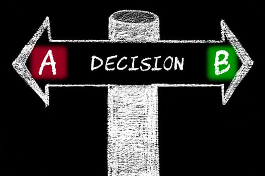 Opposite arrows with Decision A versus Decision B. Hand drawing with chalk on blackboard. Choice conceptual image