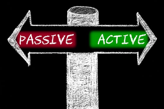Opposite arrows with Passive versus Active. Hand drawing with chalk on blackboard. Choice conceptual image