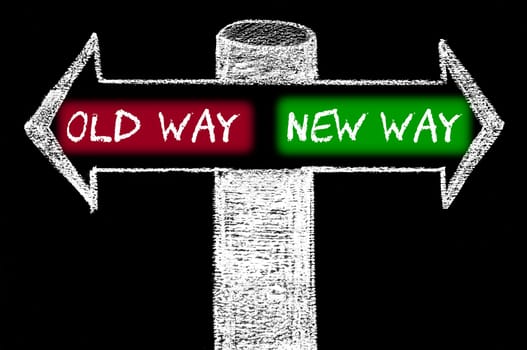 Opposite arrows with Old Way versus New Way. Hand drawing with chalk on blackboard. Choice conceptual image