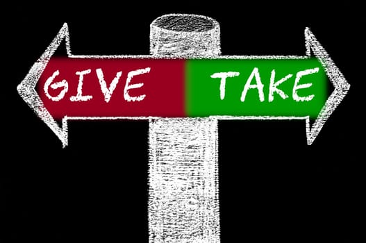 Opposite arrows with Give versus Take. Hand drawing with chalk on blackboard. Choice conceptual image
