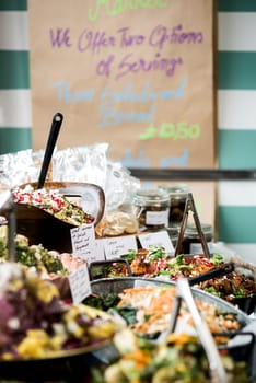 Variety of salads displayed on a buffet