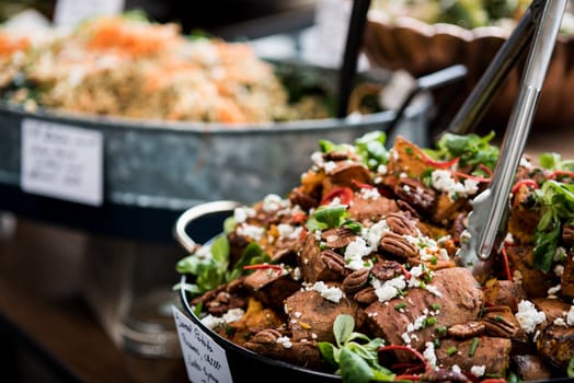 Selection of salads in the restaurant, close up.
