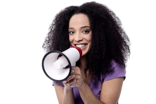 Happy female proclaiming into the loudspeaker