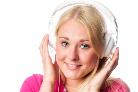 Young blonde woman with headphones in portrait