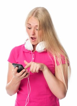 Young woman with headphones chooses music on mobile phone