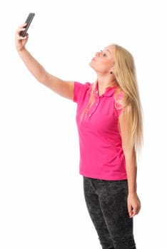 Young blonde girl takes a selfie