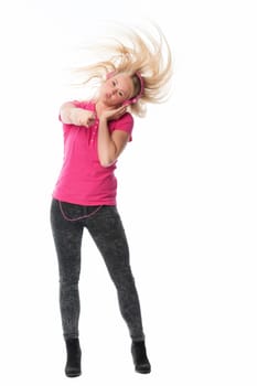 Young woman with headphones listens to music and rocks off