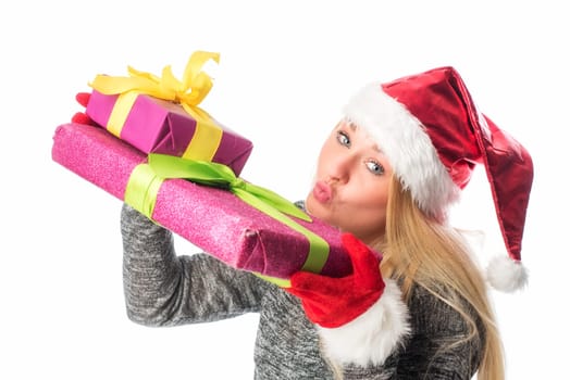 Christmas woman with gifts makes a kiss mouth