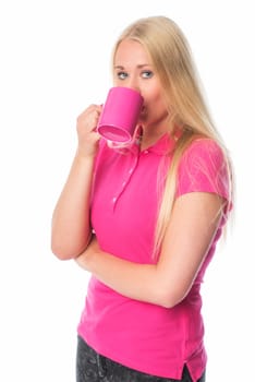 Blonde woman drinks from a coffee mug