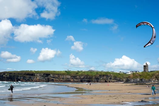 lone kite surfer getting ready at ballybunion beach on the wild atlantic way