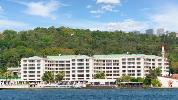 Exterior of modern architectural design five stars hotel building, suited by Bosphorus Strait, at Besiktas district, in a summer day, Istanbul, Turkey