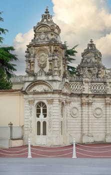 Tower at gate leading to former Ottoman Dolmabahce Palace, or Dolmabahce Sarayi, suited in Ciragan Street, Besiktas district, Istanbul, Turkey