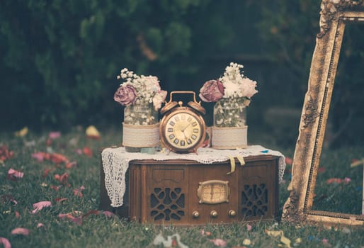 Vintage still life decoration for wedding reception. Marriage and love concept in retro style. Bridal arrangement.