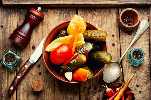 Assorted vegetable pickles, spicy pickled on a plate. Marinated vegetables
