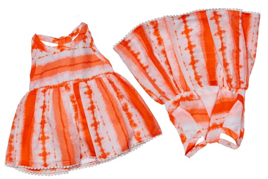 Summer dress isolated. Closeup of a beautiful orange white sleeveless baby girl dress isolated on a white background. Children spring fashion. Front and back view.
