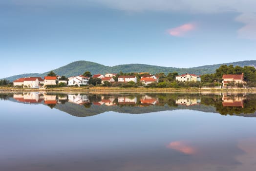 Reflection of village of Zablace near Sibenik, Croatia