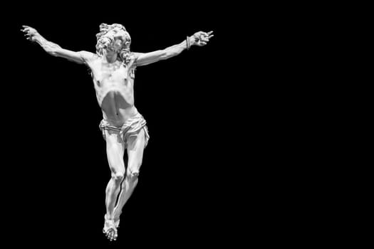 Jesus Christ - Old crucifix, Catholic Church, on black background with copy space