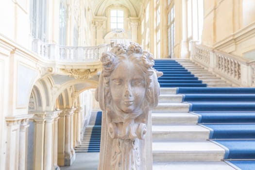 TURIN, ITALY - CIRCA JUNE 2021: The most beautiful Baroque staircase of Europe located in Madama Palace (Palazzo Madama). Interior with luxury marbles, windows and corridors.