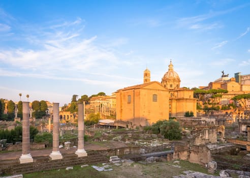ROME, ITALY - CIRCA AUGUST 2020: sunrise light with blue sky on Roman ancient architecture.