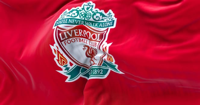 Liverpool, UK, May 2022: Liverpool Football Club flag waving. Liverpool F.C. is an english professional football club. Fabric textured background. Realistic 3d illustration. Illustrative editorial