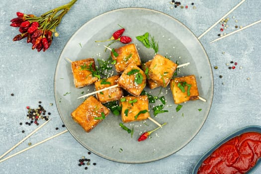 Roasted tofu cheese and sesame seeds,asian vegan food. Tahu Goreng