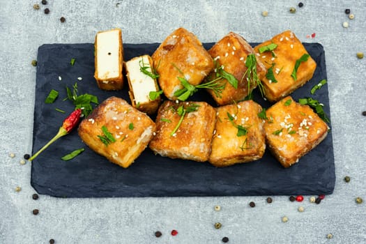 Roasted tofu cheese and sesame seeds,asian vegan food. Tahu Goreng