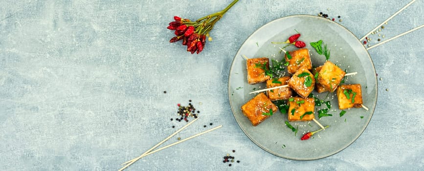 Roasted tofu cheese and sesame seeds,asian vegan food. Tahu Goreng
