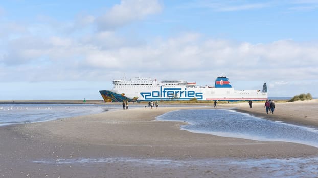 Ferry Cracovia of the ferry operator Polferries on the way from Swinoujscie in Poland to Ystad in Sweden In the foreground the beach of the Baltic Sea.