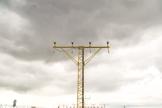 Approach Lighting System with clouds in the background.